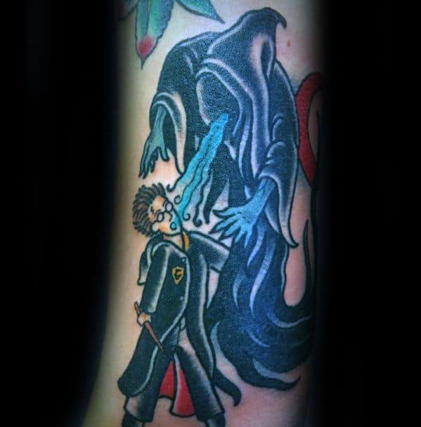Colorful tattoo of a Dementor attacking Harry Potter, with soul-sucking blue streams and bold cartoon-style outlines.
