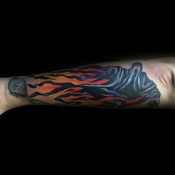 Forearm tattoo of a Dementor with fiery red and orange accents flowing from its cloak, creating a dramatic and intense look.