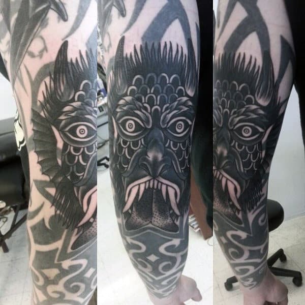 Demon Face Tattoos On Man