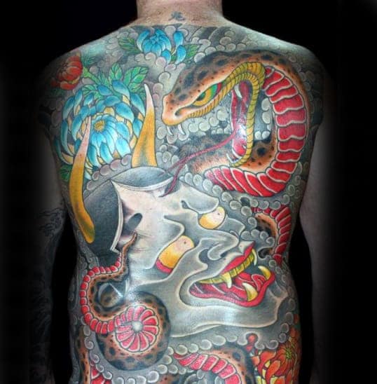 Vibrant Japanese full-back tattoo featuring a Hannya mask, coiling snake, chrysanthemums, and dynamic smoke details