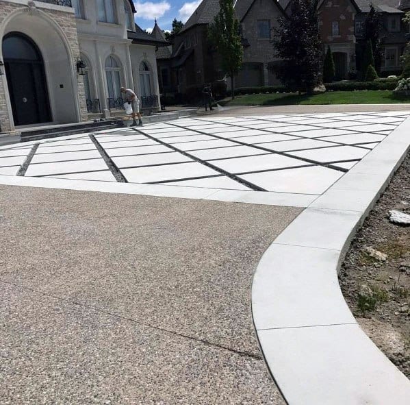 concrete paver driveway with grass joints