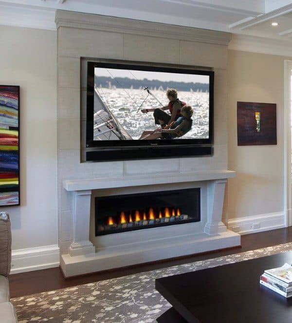 Contemporary fireplace with a long gas firebox, stone mantel, and a mounted TV above.