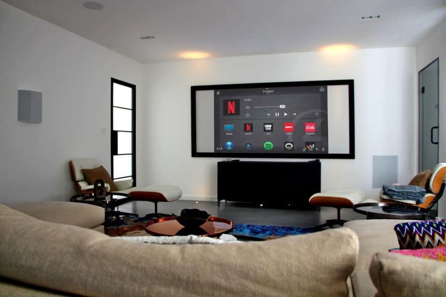 contemporary tv room with wall mounted tv