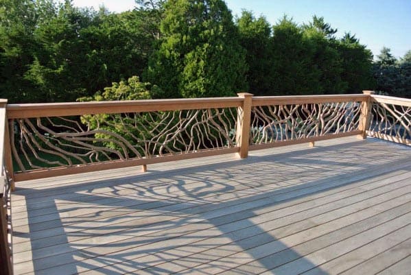 wood deck with tree branch deck railing