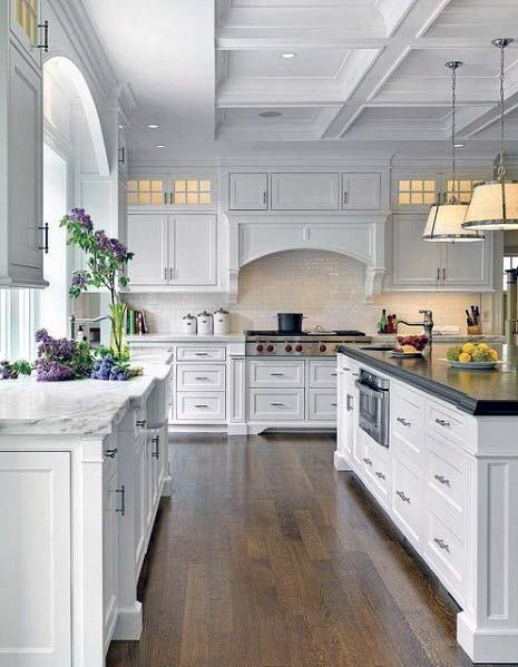 large white kitchen with arched kitchen hood cover