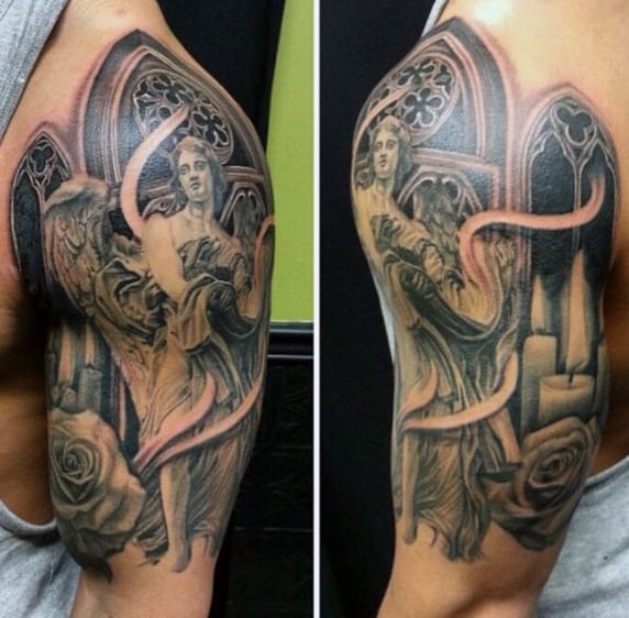 Detailed tattoo of angels, roses, and Gothic architecture on a person's upper arm