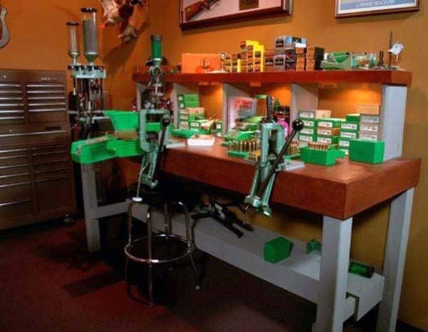 Stylish reloading bench with multiple presses, ample storage for supplies, and warm lighting for a cozy workspace.