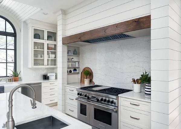 white wood panel covering kitchen