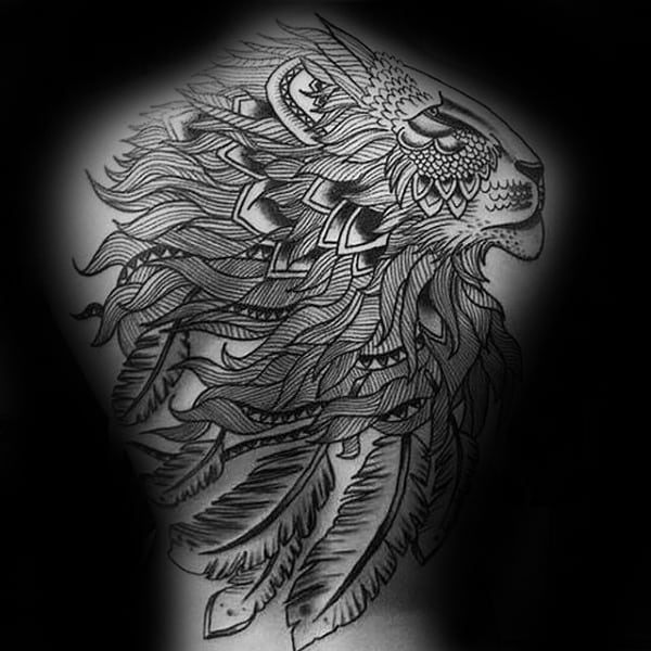 Intricate black ink tattoo of a lion with detailed feathered mane on someone's back