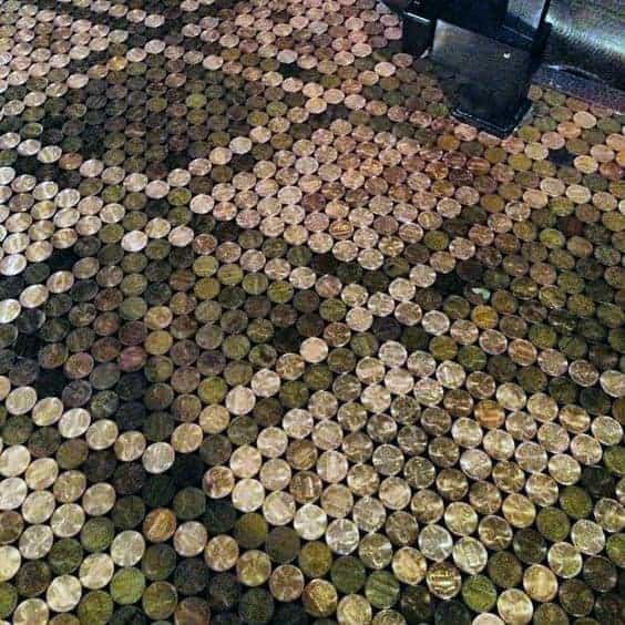 Detailed close-up of a penny floor showcasing an intricate geometric pattern, highlighted by a polished epoxy finish.