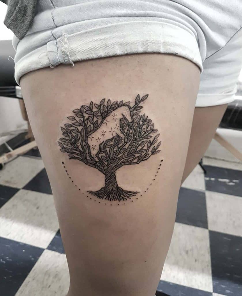 Minimalist black ink tattoo of a tree with a unicorn subtly hidden within its branches, blending nature and fantasy in an artistic thigh design.