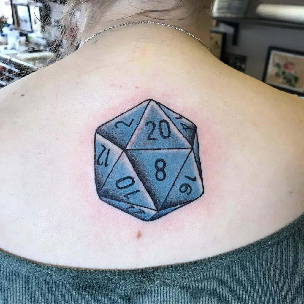 Simplistic and bold D20 tattoo in grayscale, centered on the upper back for an elegant and clean look