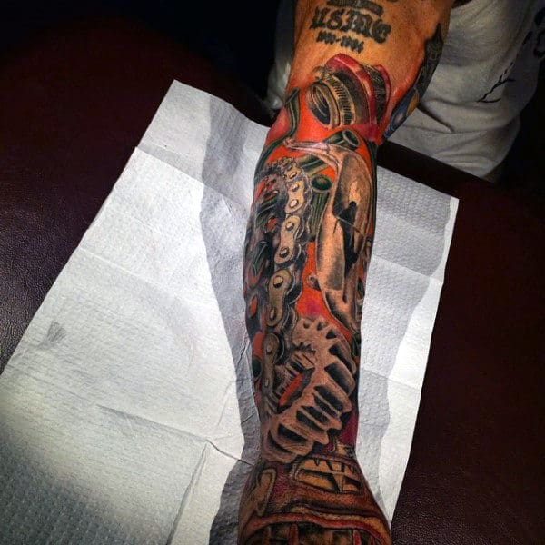 Dirt Bike Chain Tattoo On Man