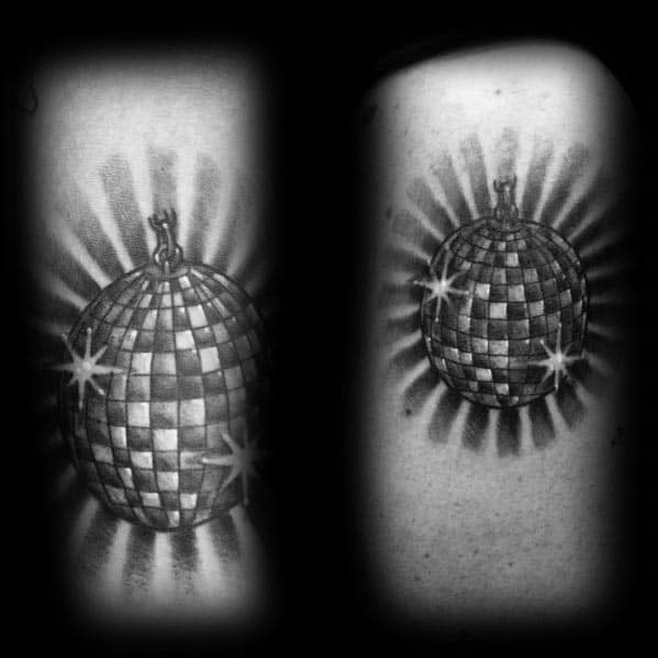 Realistic disco ball tattoo with detailed shading and light reflections, creating a glowing effect for a bold retro-inspired design.