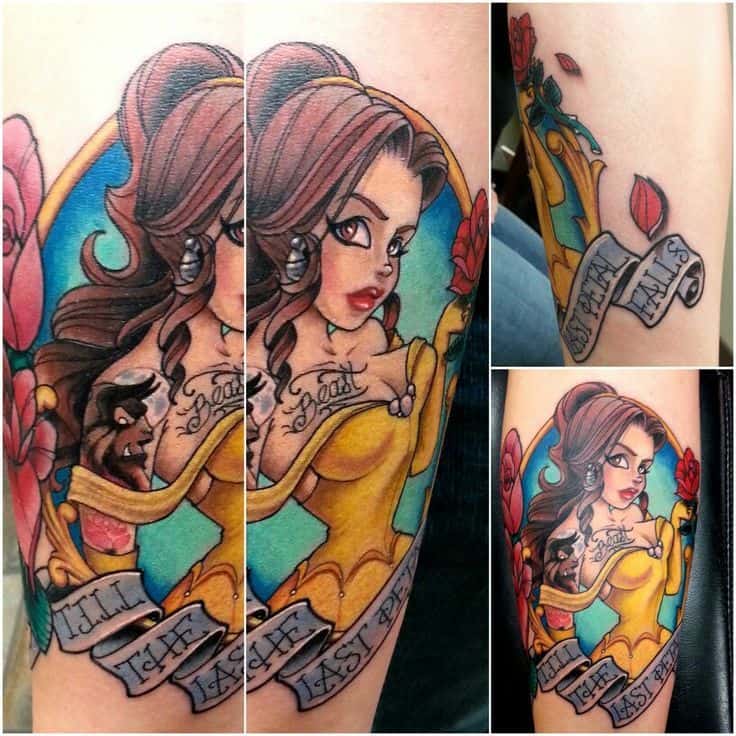 Bold tattoo of Belle in a pin-up style with a Beast portrait on her shoulder, surrounded by roses and a 'Till the Last Petal Falls' banner.