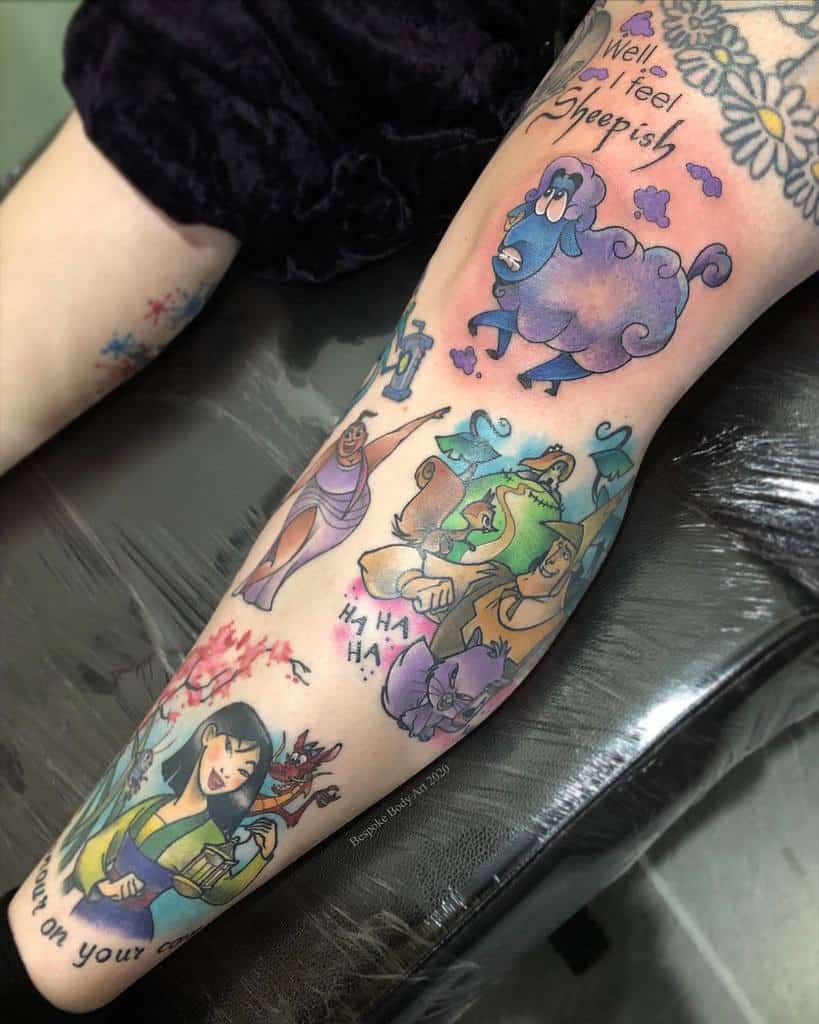 Colorful tattoo leg sleeve featuring whimsical cartoon characters from Mulan and other Disney characters design, with a humorous sheep character and playful phrases like 'Well I feel Sheepish' and 'Ha Ha Ha.'