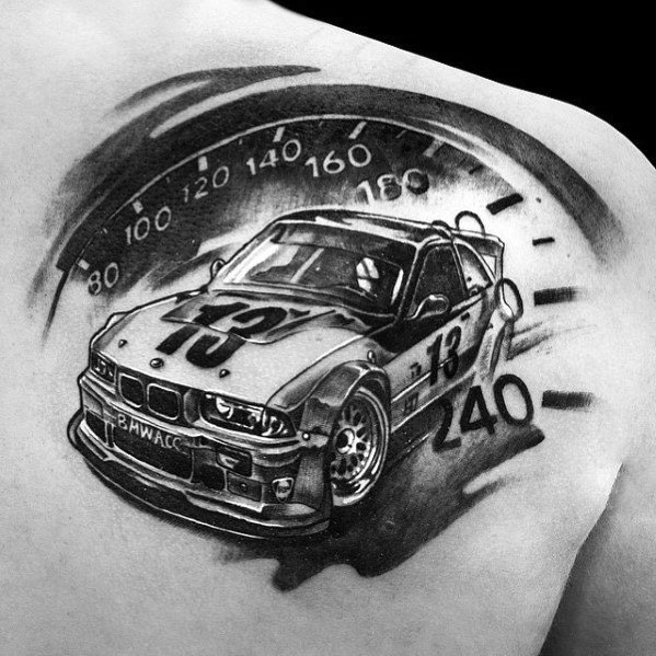 Bold BMW race car tattoo on shoulder, featuring an E36 with a speedometer backdrop and dynamic shading for a high-performance look.