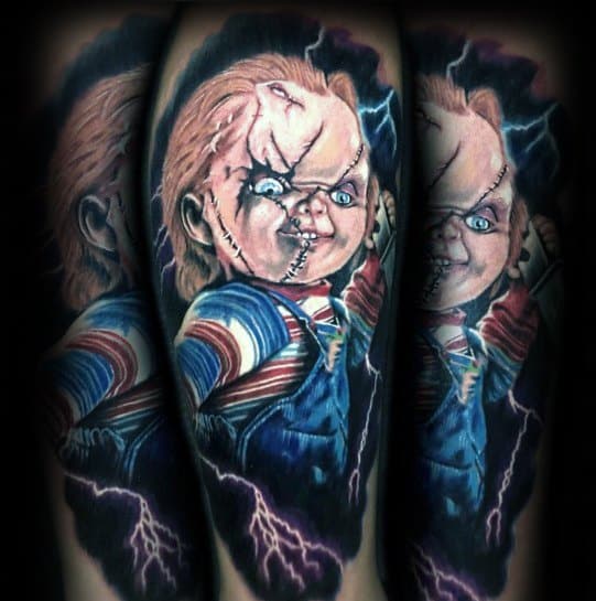 Realistic Chucky tattoo with glowing blue eyes, stitched face, and lightning effects, creating a dramatic and electrifying horror design.