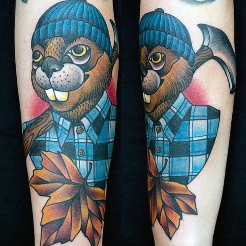 Lumberjack beaver tattoo in a blue plaid shirt and beanie, holding an axe with autumn leaves and bold cartoon-style shading.