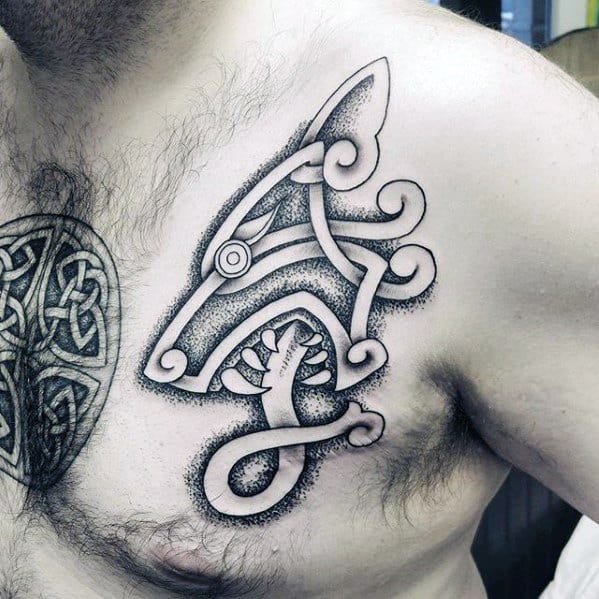 Celtic wolf head tattoo on chest with dotwork shading and bold curves forming a stylized, abstract design with knot-like features.