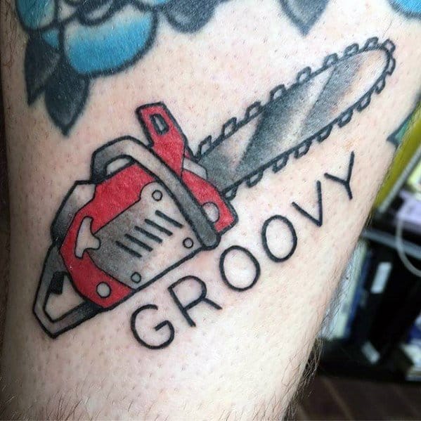 Simple red and gray chainsaw tattoo with the word "GROOVY" beneath it, combining horror flair with playful, bold lettering.