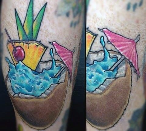 Vibrant coconut drink tattoo with blue liquid splash, pink umbrella, pineapple slice, cherry, and tropical leaves.