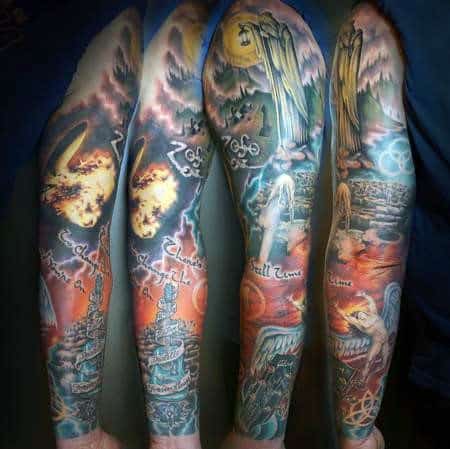 Full sleeve Led Zeppelin tattoo in vibrant color featuring the hermit, Zoso symbol, Icarus figure, and fantasy-inspired landscape scenes.