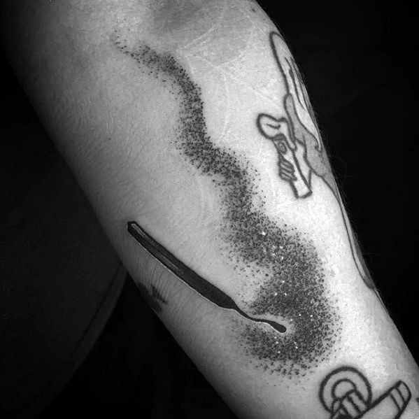 Black and grey tattoo of a burnt matchstick with a long, textured smoke trail in dotwork style, symbolizing fading energy or quiet impact.