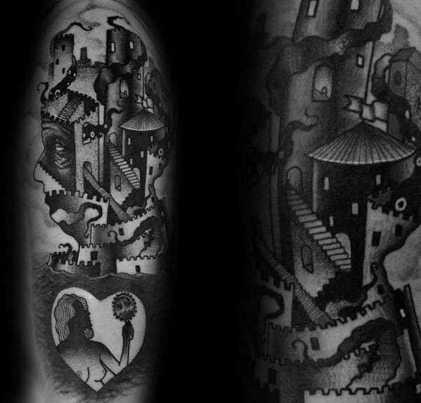 Surreal MC Escher-style tattoo of an optical illusion castle forming a face, with a heart-shaped scene of a girl holding a dandelion.