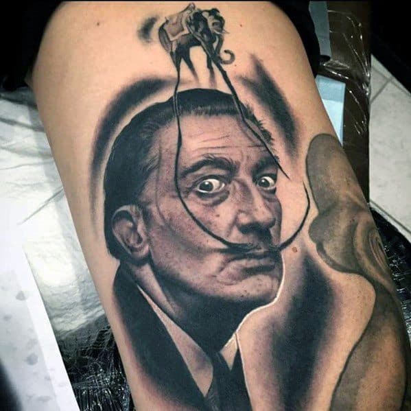 Realistic Salvador Dali portrait tattoo with a surreal elephant walking along his mustache, blending classic portraiture and dreamlike imagery.