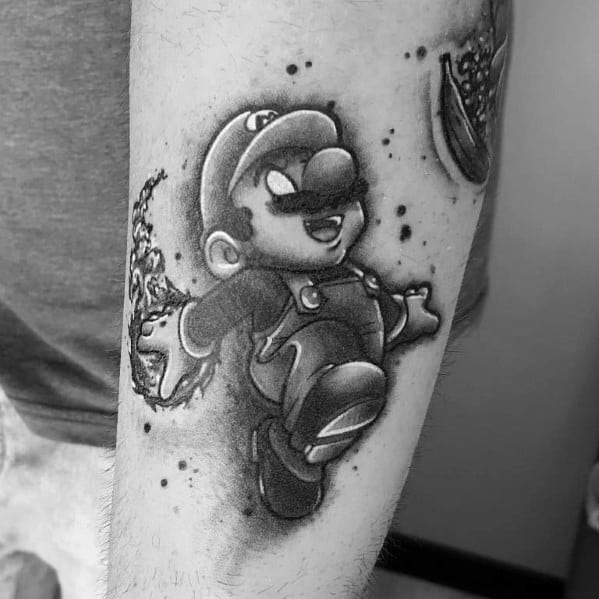 Black and gray Mario tattoo with realistic shading, showing him floating in mid-air with dynamic energy effects for a bold, classic design.
