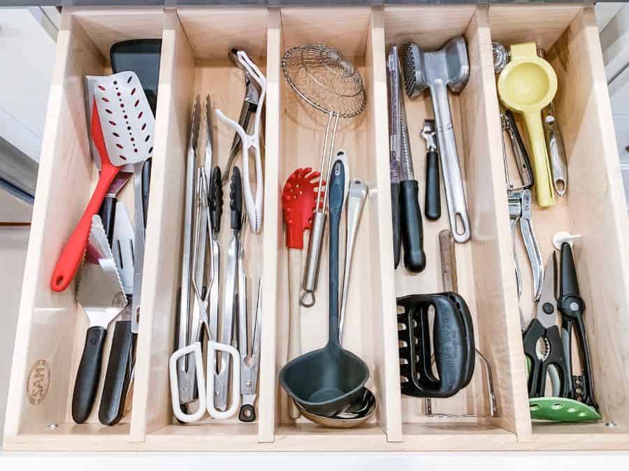 kitchen utensils stored in kitchen draw