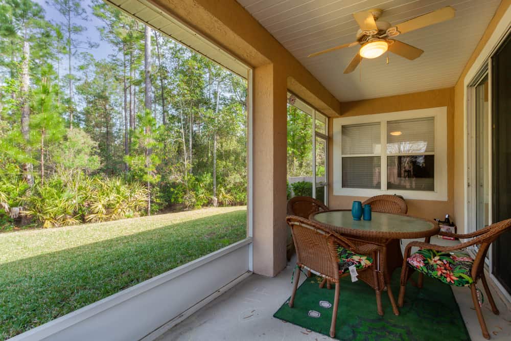 diy enclosed patio fake grass wicker glass top table and chairs 