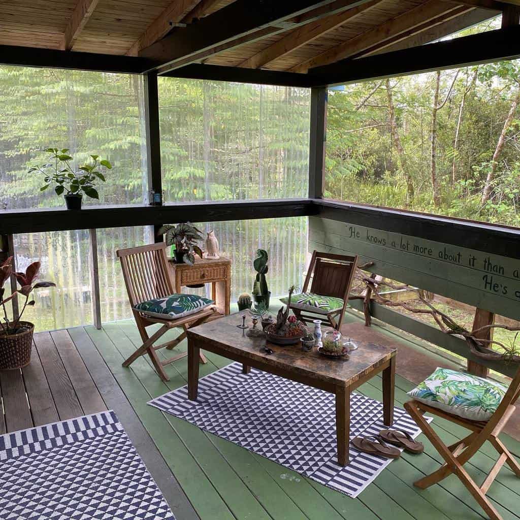 patio deck enclosed small table and chairs forest view 