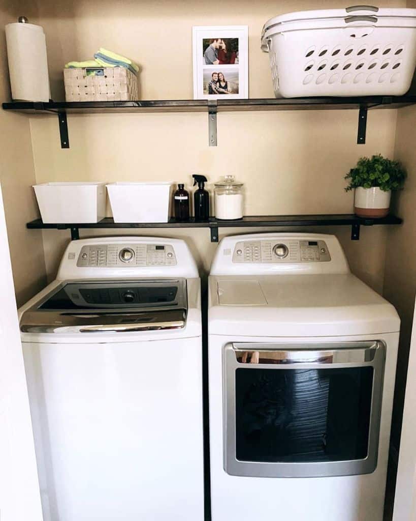 washer and dryer wood shelving laundry space 