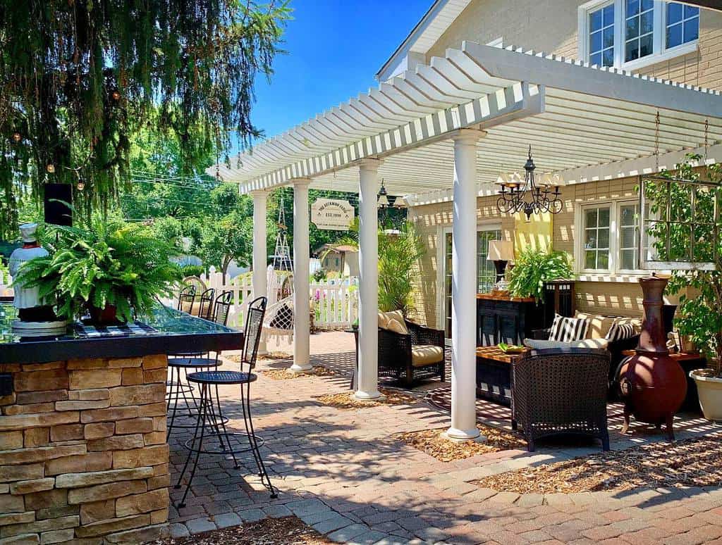 white diy patio awning with stone bar