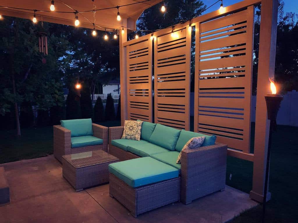 stylish backyard patio with wicker sofa