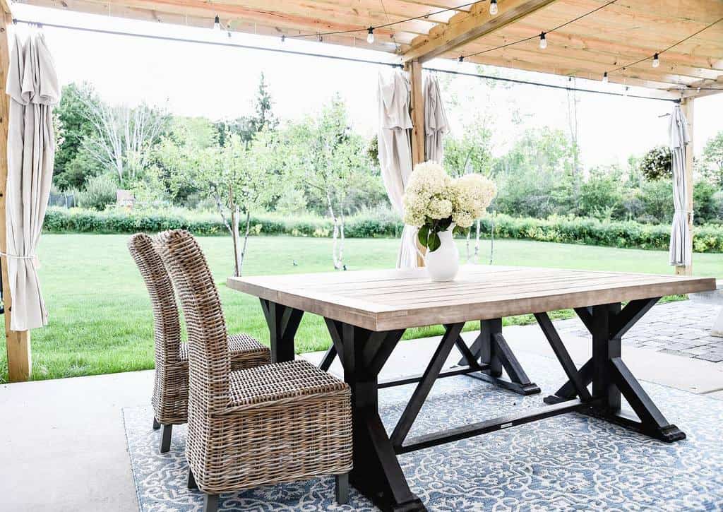 deck patio with wood pergola and string lights
