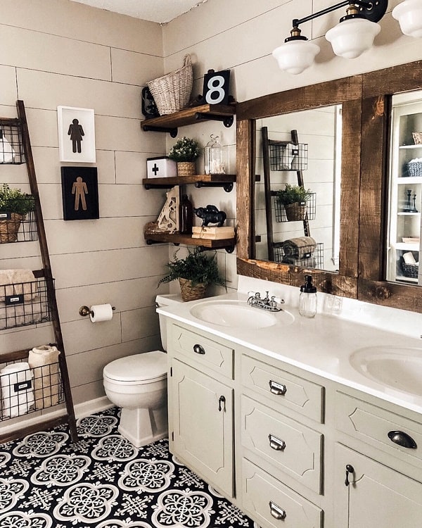 Farmhouse-style bathroom with wooden shelves, patterned floor tiles, and a double sink vanity