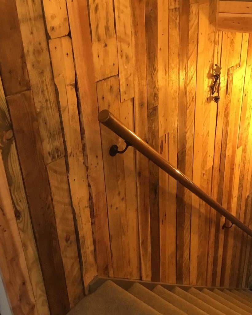 wood wall covering stairs to basement
