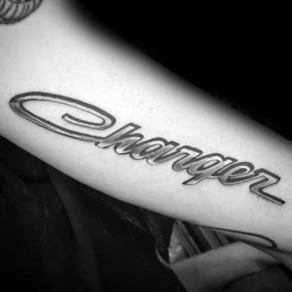 Bold 'Charger' script tattoo in black and grey, showcasing a sleek, classic font inspired by the iconic Dodge muscle car.