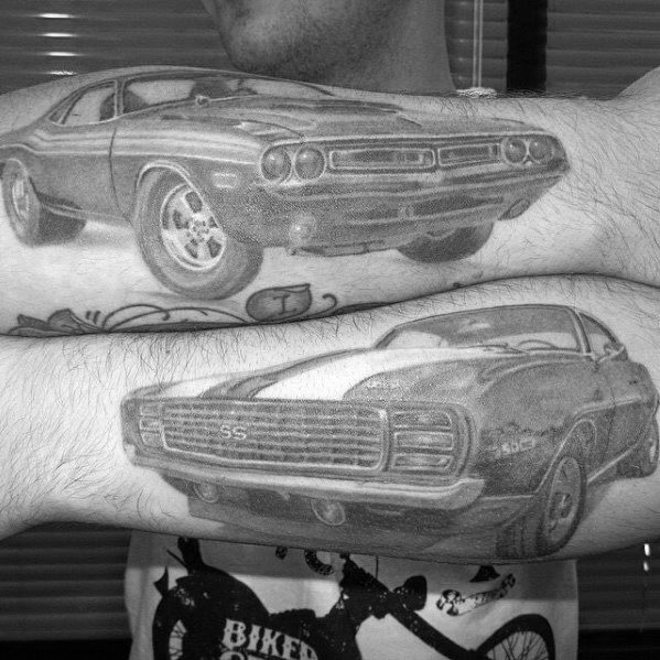 Black and grey forearm tattoos featuring a Dodge Challenger and a Chevy SS, showcasing detailed muscle car designs with a bold look.