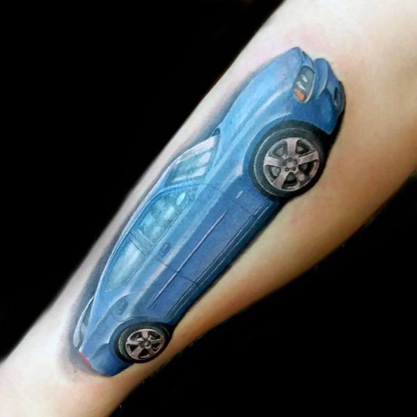 Realistic blue Dodge Charger tattoo on forearm, featuring fine details and shading for a bold and dynamic muscle car design.