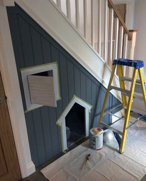 small dog house under stairs