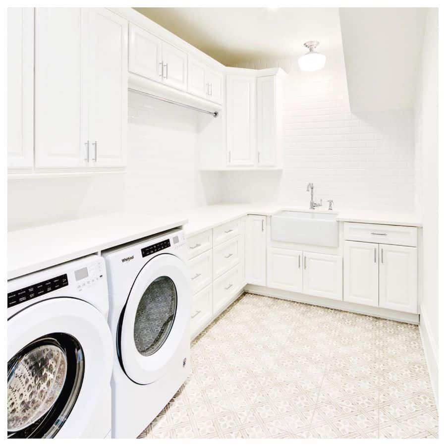 large white laundry cabinets apron sink washer and dryer