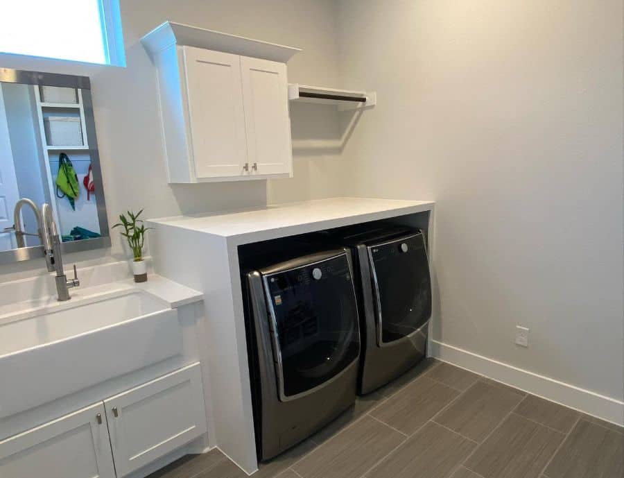 large apron sink washer and dryer laundry room