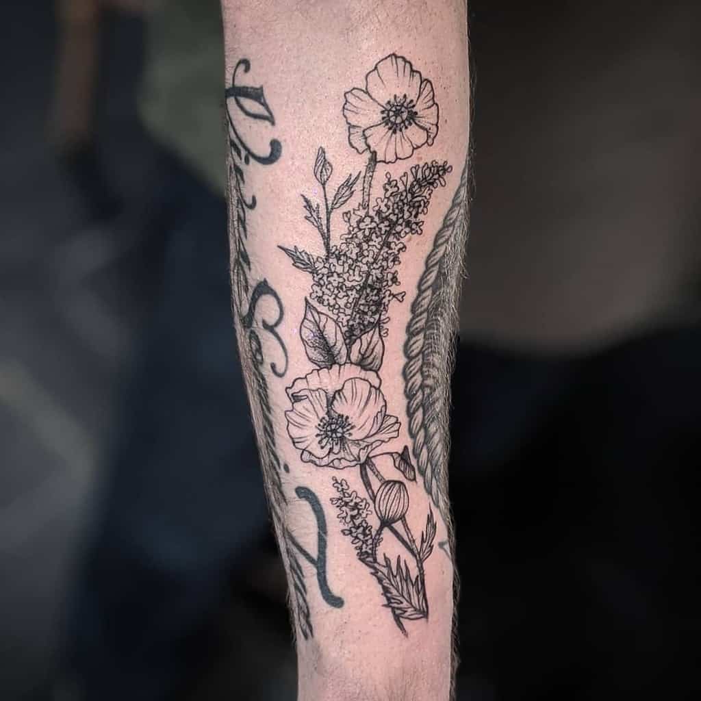 A delicate black-and-grey forearm tattoo featuring detailed dot work, incorporating poppies and lilac flowers for a natural and elegant design