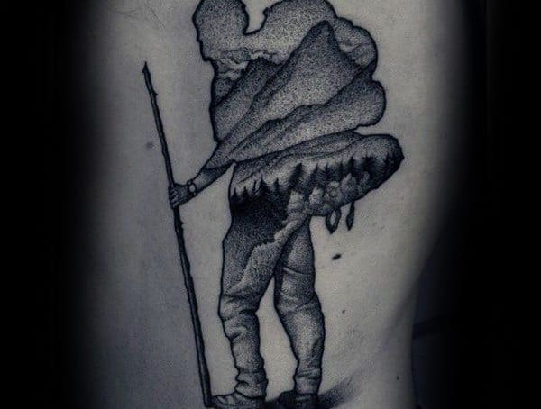 Dotwork tattoo of a hiker carrying a backpack, with mountains and trees integrated into the design, creating a nature-inspired silhouette effect.