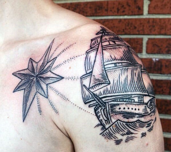 Tattoo of a ship and compass star on an upper arm and shoulder