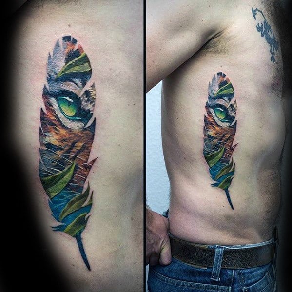 Colorful feather tattoo with a hidden owl face inside, blending natural textures and vivid shades along the side of the torso.
